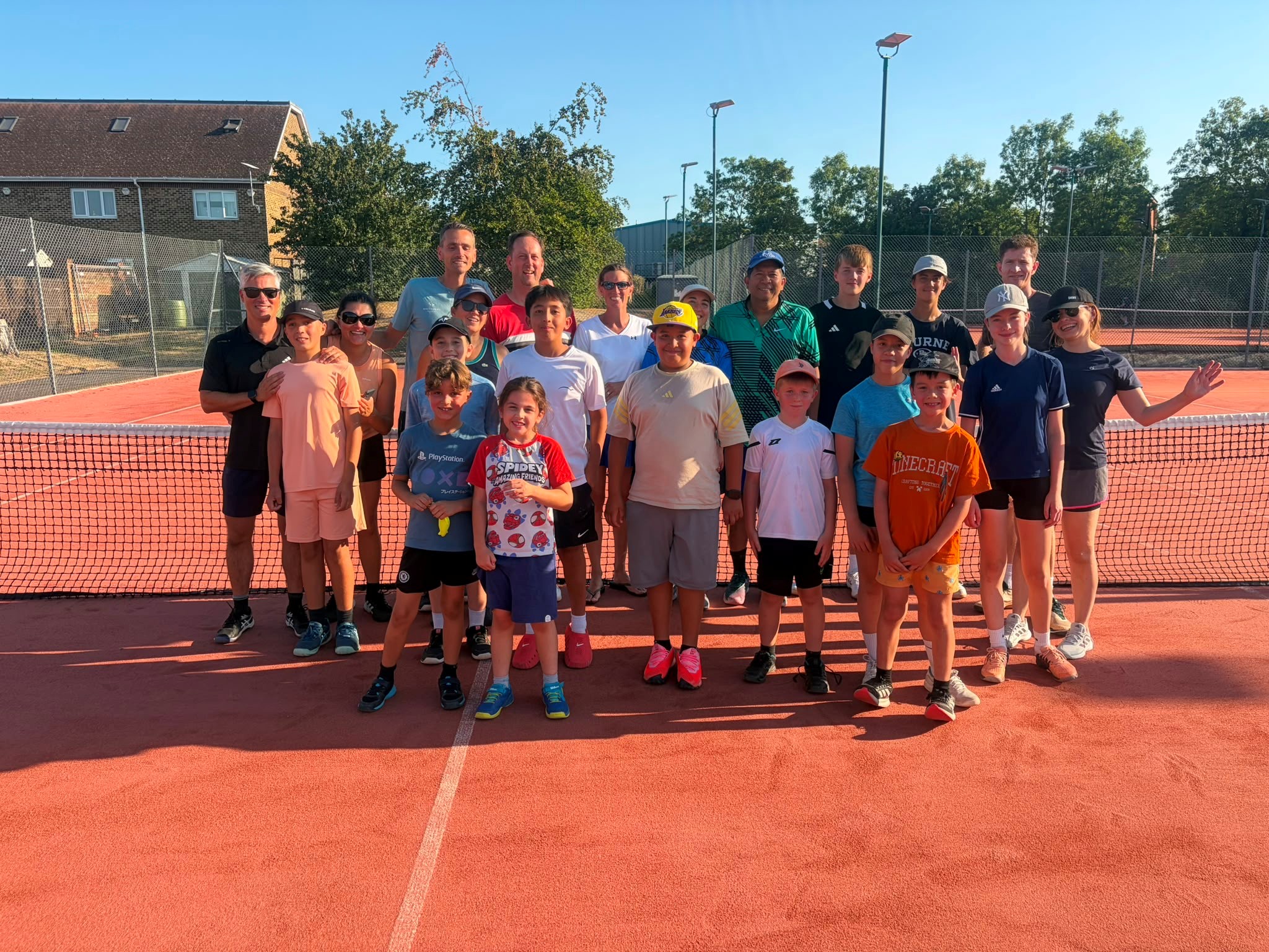 Junior players and coaches on the tennis court at Bromley Wendover
